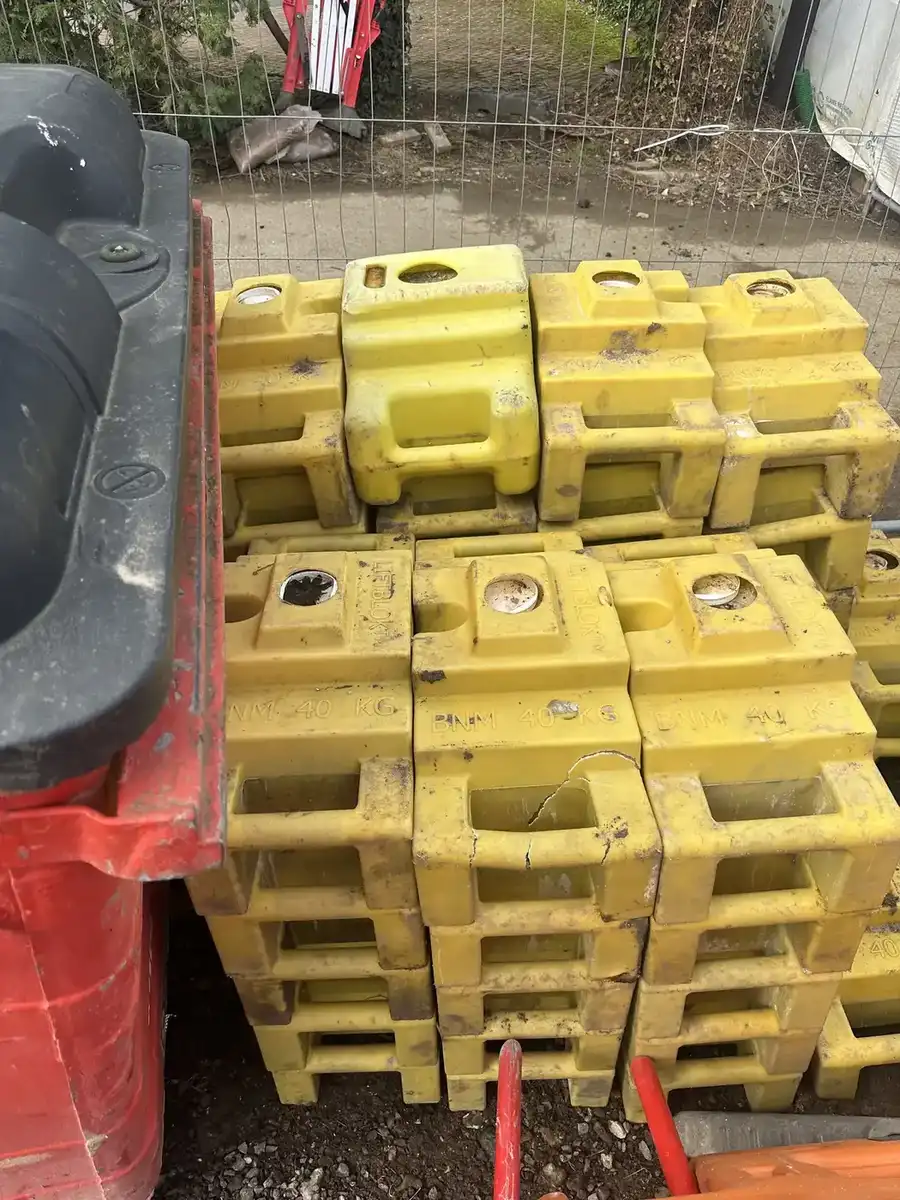 Yellow weighted barrier bases loaded for removal