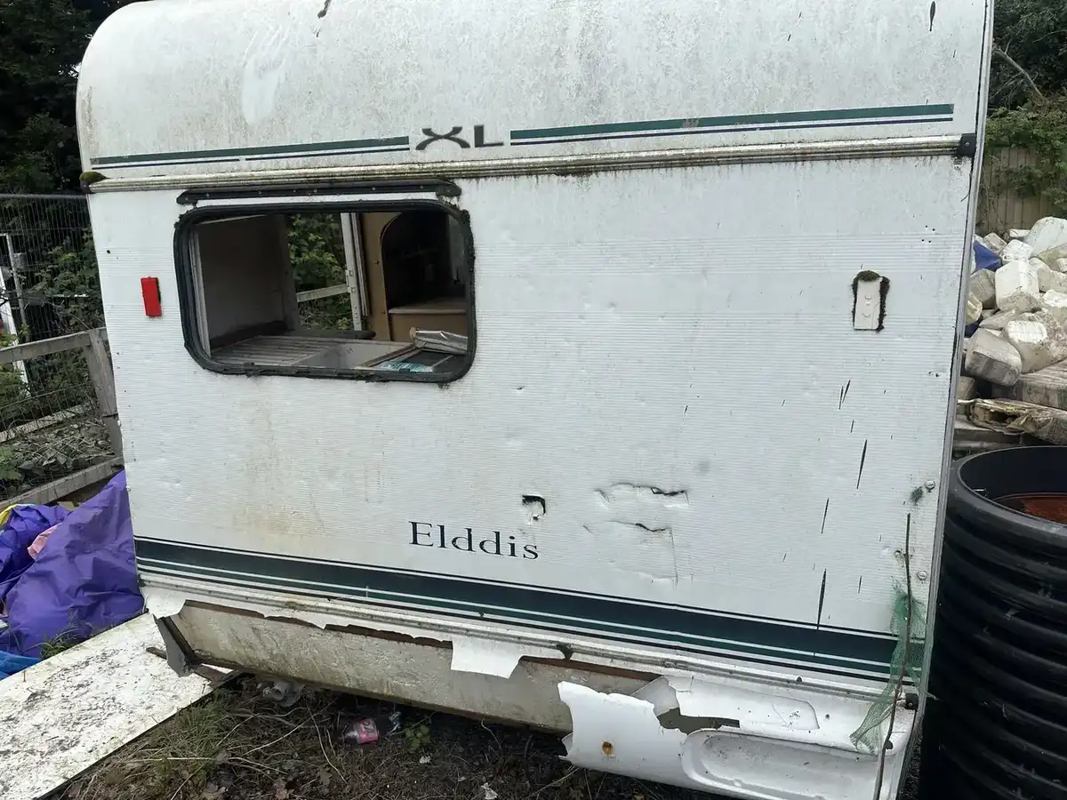 Caravan within outdoor clearance area
