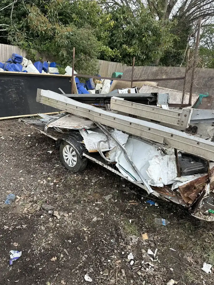 Trailer and mixed materials during site clearance